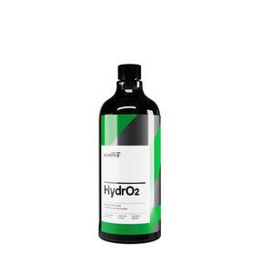 flacone di CARPRO HydrO2, un sigillante idrofobico per la protezione della carrozzeria dell'auto. Il flacone è nero con un'etichetta bianca e verde, e il nome del prodotto "HydrO2" è chiaramente visibile. Questo prodotto è progettato per offrire una protezione avanzata utilizzando la nanotecnologia, garantendo una finitura brillante e duratura.